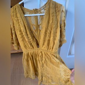 One piece short suit, low front, size medium.